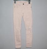 Rosa stretchjeans med h&aring;l p&aring; kn&auml;na
